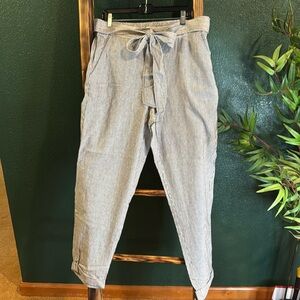 Pin stripe trousers.